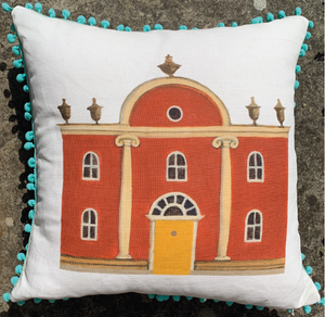 Folly Cushion with blue pom poms