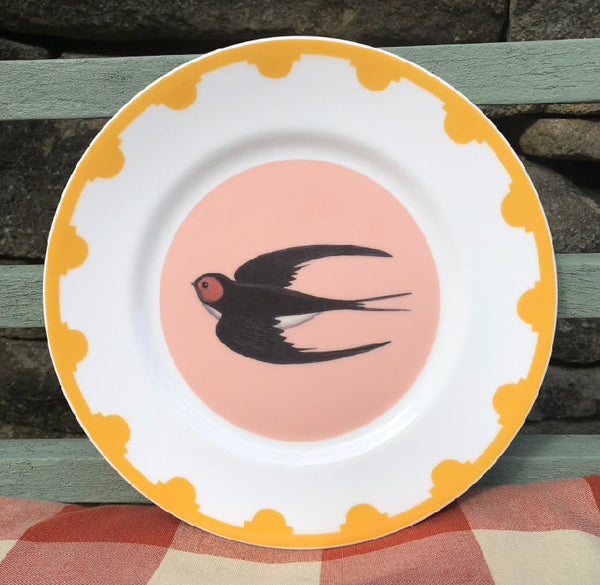 Yellow bordered plate with a swallow in the centre