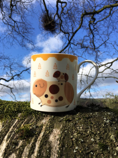 Two-sided fine bone china mug depicting Doris and her guinea pig babies